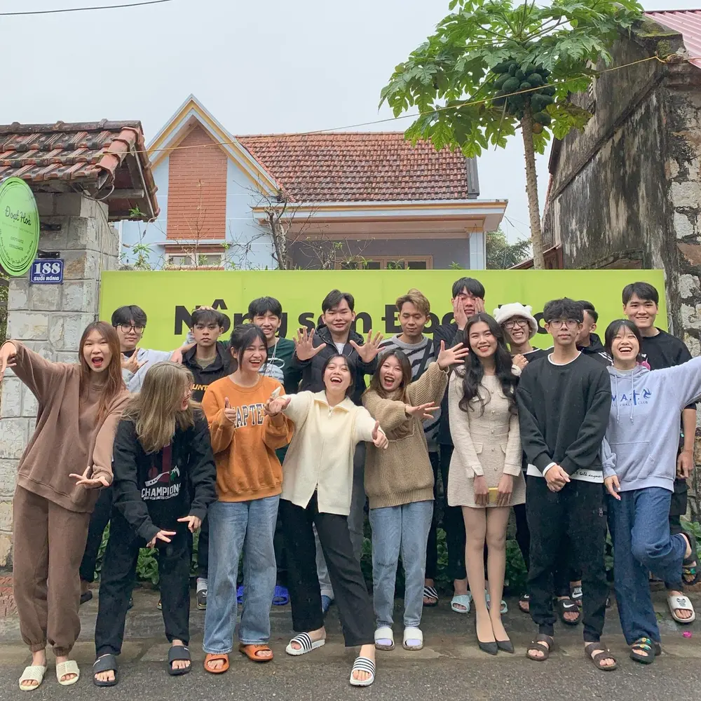 Green Up Youth members laughing and cheering together outdoors